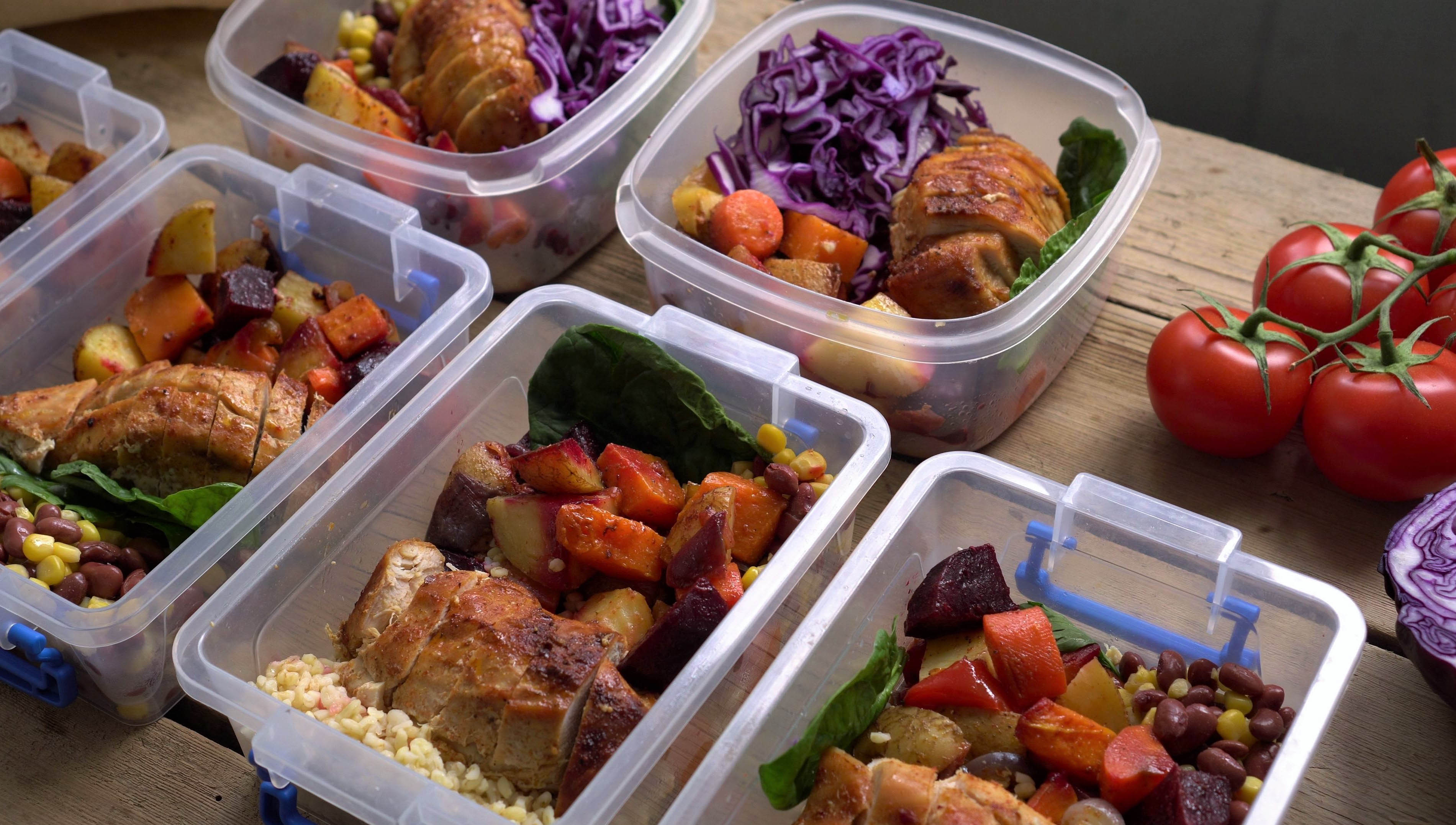 Multiple contains of meal prep that includes chicken, corn, beans, potatoes, and vegetables Multiple contains of meal prep that includes chicken, corn, beans, potatoes, and vegetables